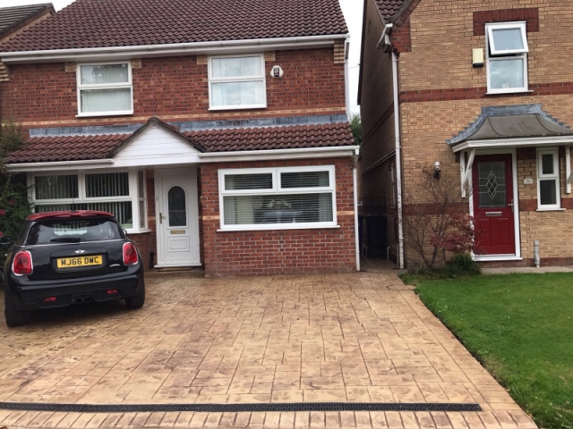 Sandstone and Mahogany Release printed in Ashlar concrete driveway