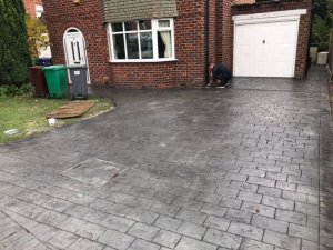 New concrete driveway in Basalt Grey and printed in large London Cobble