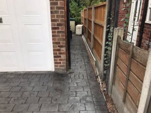 New concrete driveway in Basalt Grey and printed in large London Cobble