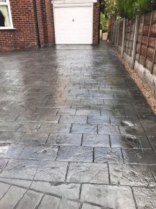 New concrete driveway in Basalt Grey and printed in large London Cobble