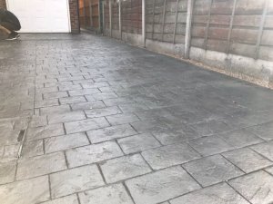 New concrete driveway in Basalt Grey and printed in large London Cobble