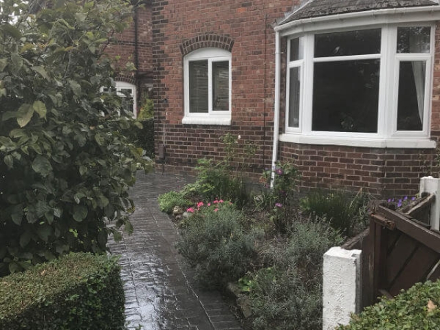 A pattern imprinted concrete patio and paths in the Burnage area of Manchester