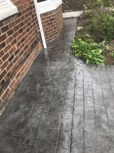 A pattern imprinted concrete patio and paths in the Burnage area of Manchester