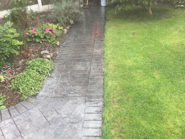 A pattern imprinted concrete patio and paths in the Burnage area of Manchester