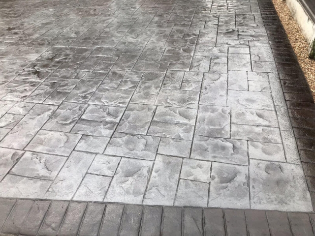 New concrete driveway in platinum grey colour