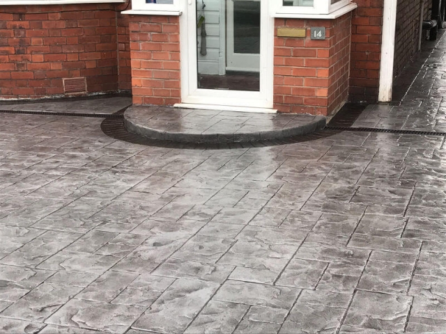 New concrete driveway in platinum grey colour