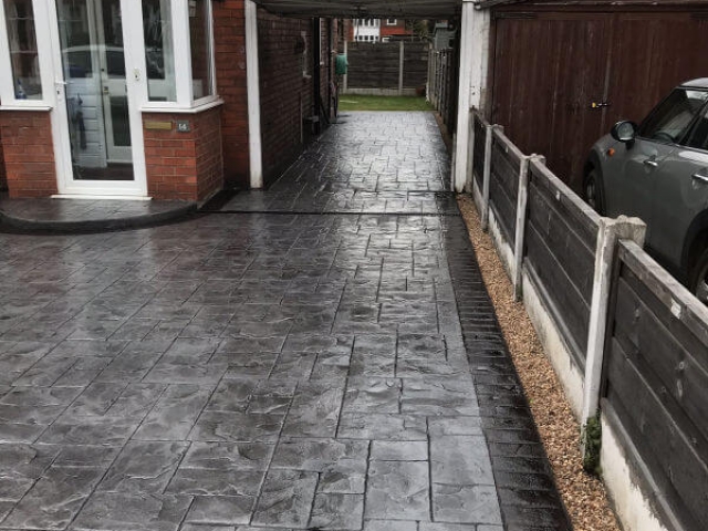 New concrete driveway in platinum grey colour