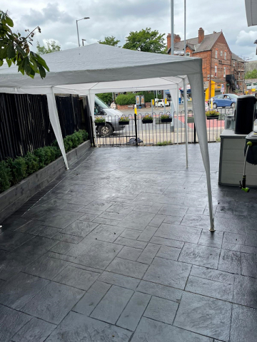 New pattern imprinted concrete patio in Moss Side, Manchester